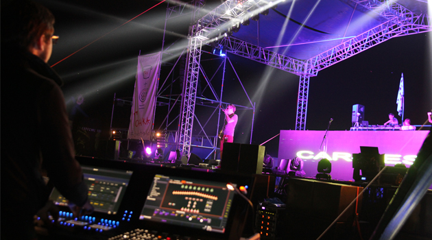 Lighting designer Evgeniy Toma using a Cobalt 20 console at Car-Fest 2014