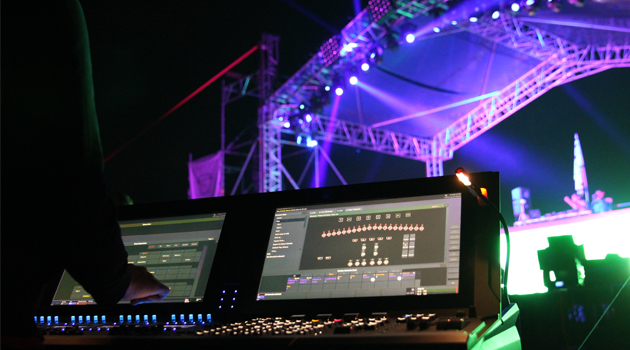 Lighting designer Evgeniy Toma using a Cobalt 20 console at Car-Fest 2014