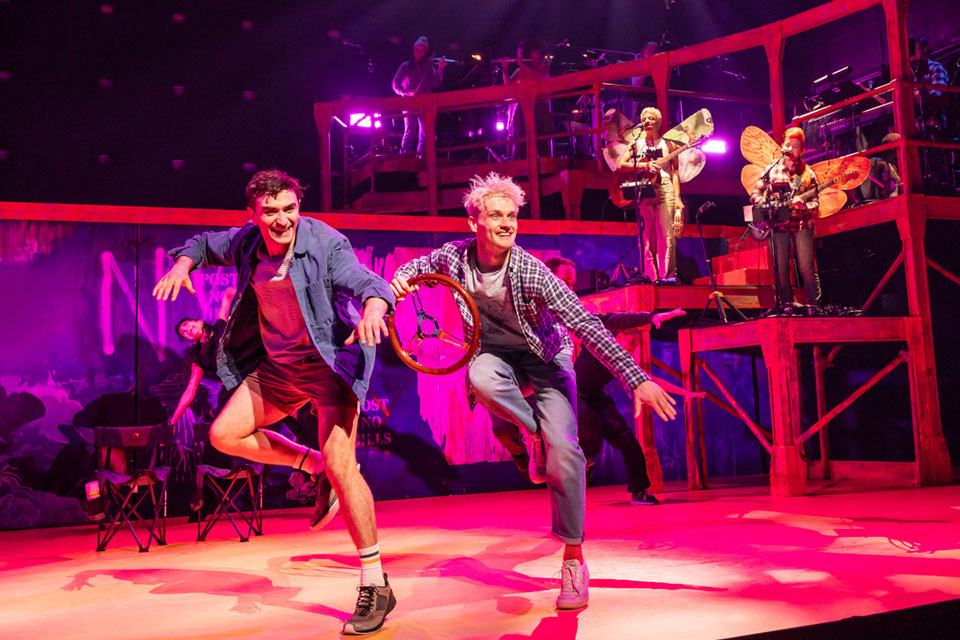 The Broadway Cast of Illinoise, illuminated by the reflections of Source Four’s light on a yellow floor